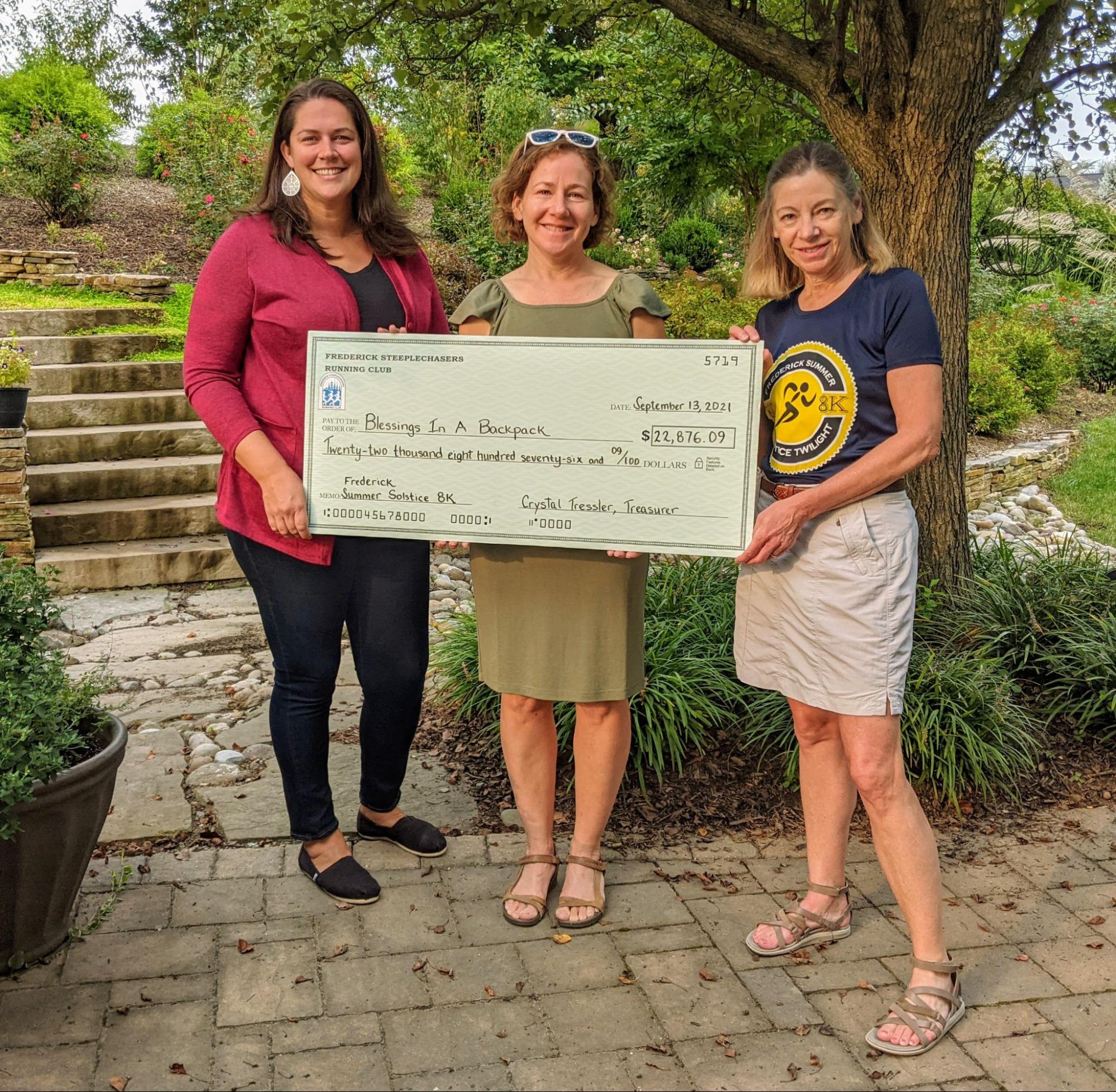 Angela Abrishami, Executive Director, Blessings In A Backpack, Crystal Tressler, Treasurer, Frederick Steeplechasers Running Club, Harriet Langlois, Race Director, Frederick Summer Solstice 8K